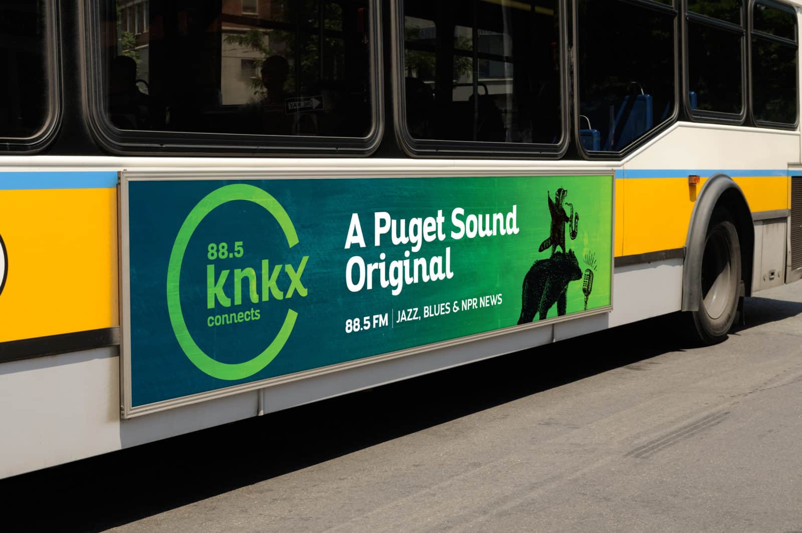 A KNKX advertisement on the side of a bus