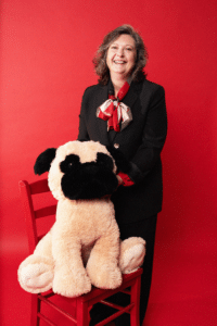 JayRayer Joyce Glavish poses with a large stuffed dog