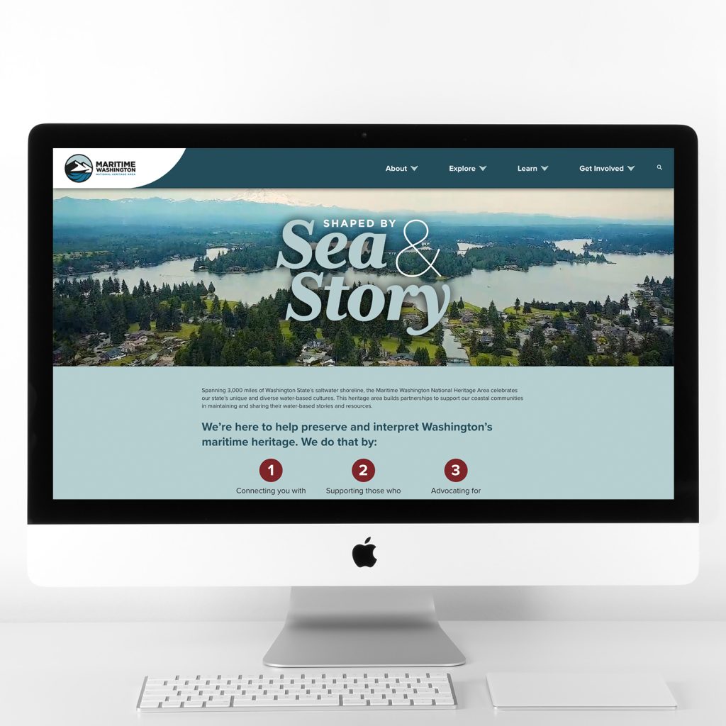 Photo of a Mac computer screen with the Maritime Washington Heritage Area website on the screen