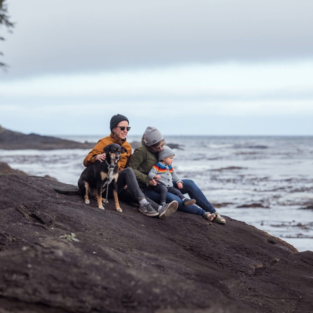 Photo of two people on the beach with their dog at Salt Creek Recreation Area near Port Angeles, Washington