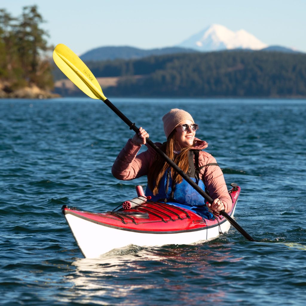 Photo of a woman kayaking near San Juan Islands in Washington state