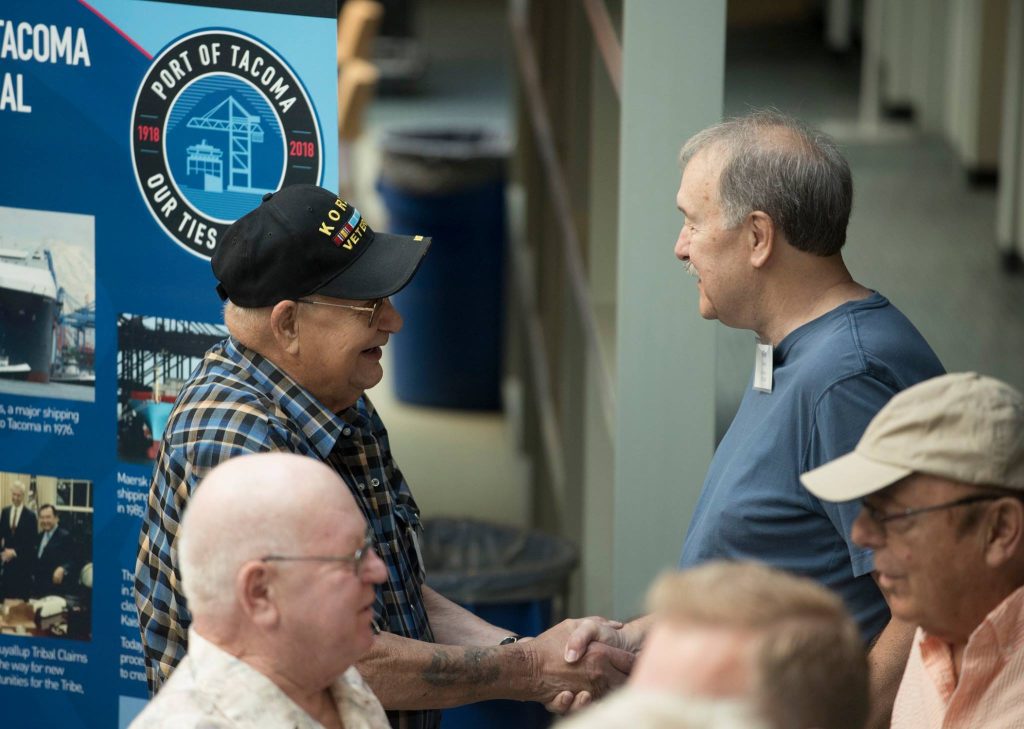 photo of Port of Tacoma retirees connecting at pop-up museum opening